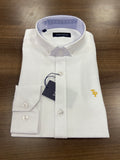 White dress shirt with a logo on a wooden surface