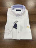 Folded white dress shirt with a tag on a wooden surface
