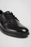 mans black shoe